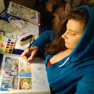 Maria colora ad acquerello il fumetto "Il Giornalista"